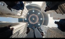 A flying saucer looms over New York skyscrapers.