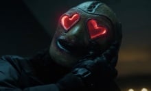 A man in a mask with giant hearts for eyes.