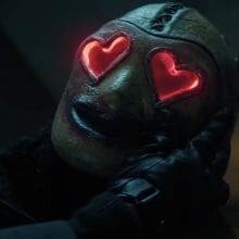 A man in a mask with giant hearts for eyes.