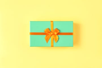 green gift box with yellow ribbon