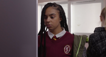 a young girl with braids