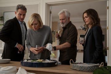 the diplomat season 3 stars rufus sewell alison janney bradley whitford and keri russell looking at something round a kitchen cabinet