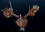 Oil prices slide to 4-year lows; recession fears mount