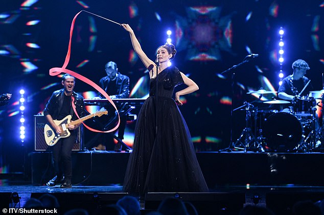 She put on a high energy performance as she sang her latest hit 'Freedom of the Night' whilst twirling a red ribbon around on stage