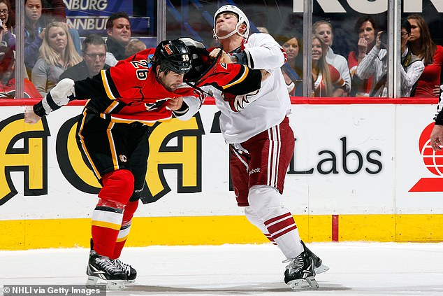 Bissonnete (right, seen in 2012) became known for fighting his opponents in the NHL