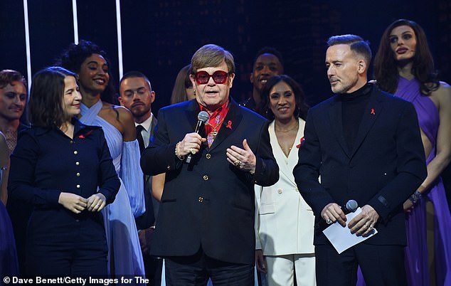 Shaina Taub, Sir Elton John and David Furnish speak on stage at "The Devil Wears Prada Musical" charity gala night