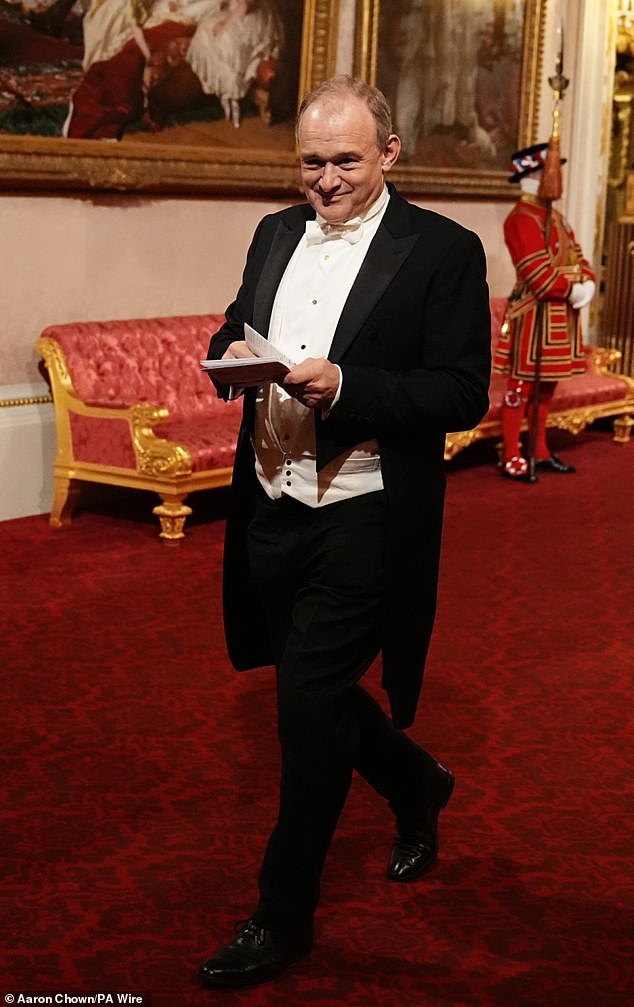 Liberal Democrat leader Sir Ed Davey smiling as he walked towards the East Gallery for the banquet