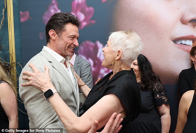 The Greatest Showman star had a 'traumatic' start to life when his own mother Grace left him as a child to start a new life in the UK. Pictured hugging Tammy Reynolds