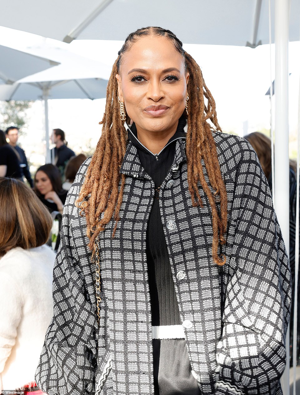 Acclaimed filmmaker Ava DuVernay looked the picture of elegance in black and white tweed jacket over a zip up jumper underneath