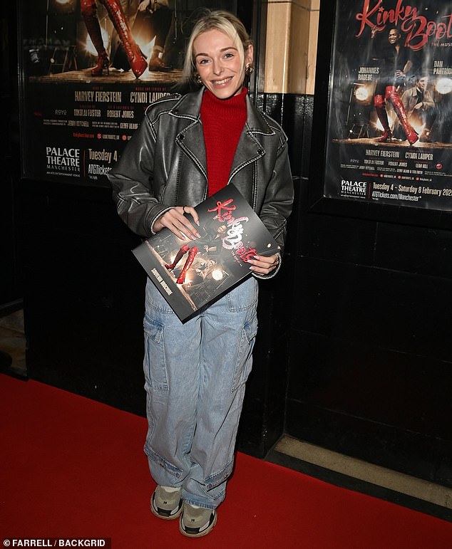 Coronation Street star Cait Fitton, 22, wore a black leather jacket over a red turtleneck jumper, adding a pair of light blue baggy jeans