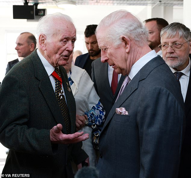 102-year-old D-Day veteran Eugeniusz Niedzielski (pictured left) chatted with Charles at the event