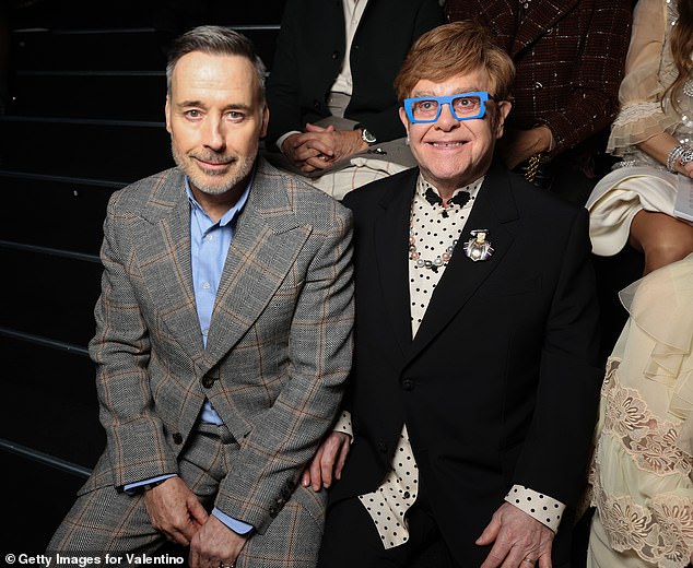 The musician has been supported by husband David Furnish (pictured) during his recent health struggles