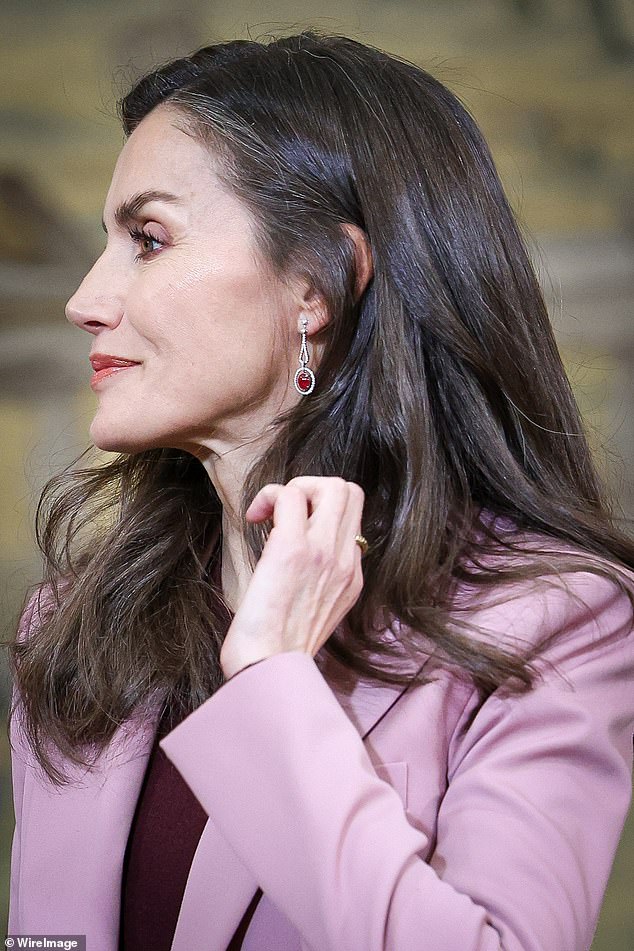 The 52-year-old royal added to her ensemble with a pair of opulent diamond and ruby drop earrings