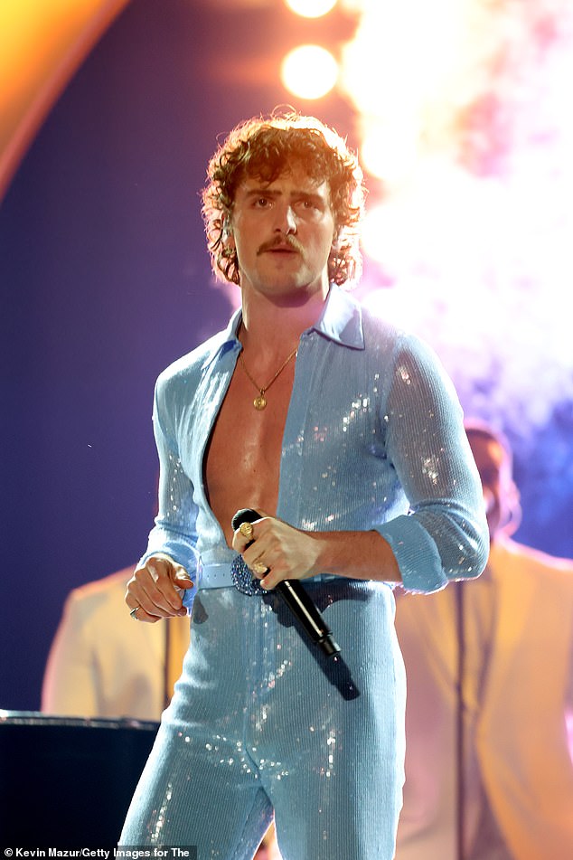 Last Sunday, Boone - who caught Jennifer Lopez's eye at the Grammys - lost the trophy for best new artist to Chappell Roan, but he still made quite an impression with his sparkly blue jumpsuit and subsequent 'aggressive' crotch grab