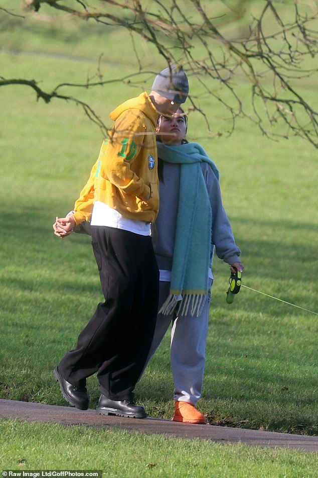 The couple looked more in love than ever as they shared a passionate smooch while taking their dog for a walk