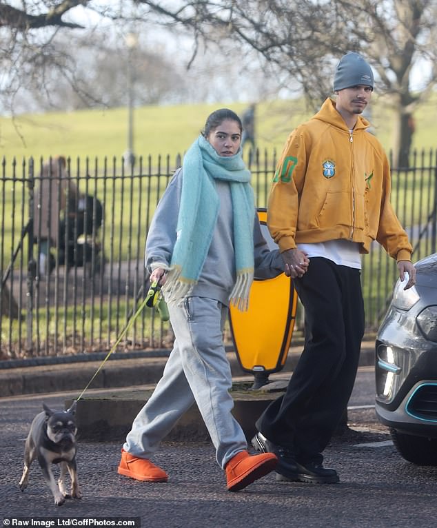 Romeo Beckham packed on the PDA with his girlfriend Kim Turnbull as they went for a stroll on Primrose Hill on Wednesday