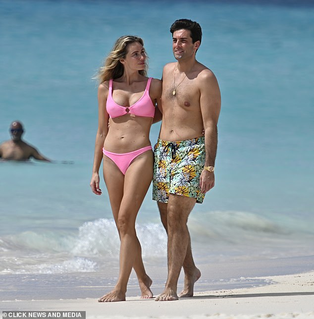 The former TOWIE star, 37, couldn't keep his hands off the Swedish model, 31, as they locked lips before strolling arm-in-arm along the sand