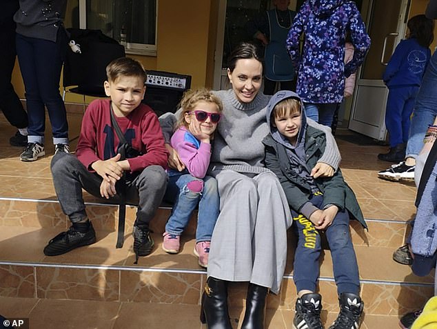 Angelina Jolie poses for photo with kids in Lviv, Ukraine, Saturday, Apr. 30, 2022