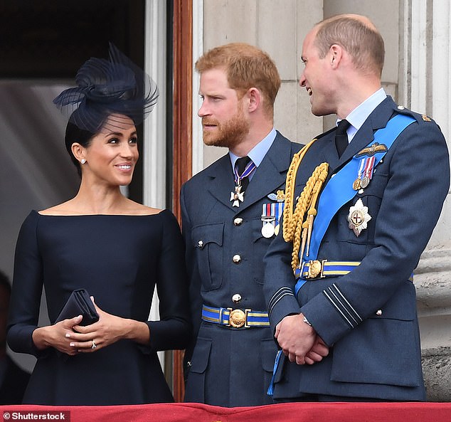 Meghan, Prince Harry and Prince William on the Buckingham Palace balcony in July 2018