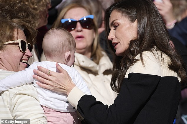 Queen Letizia of Spain was greeted warmly in Caravaca de la Cruz by the crowds but made a beeline for some of its youngest members