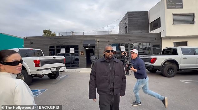 As the couple arrived at a recording studio in Los Angeles on Tuesday, Kanye told photographers: 'Ask me how it was to beat the Grammys?'