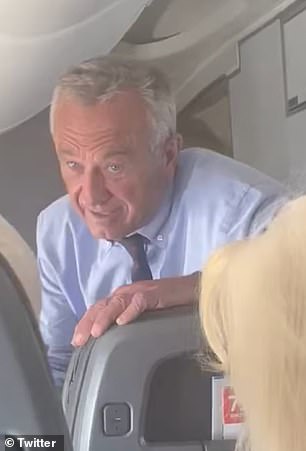 RFK Jr is seen here speaking with someone behind him on his flight