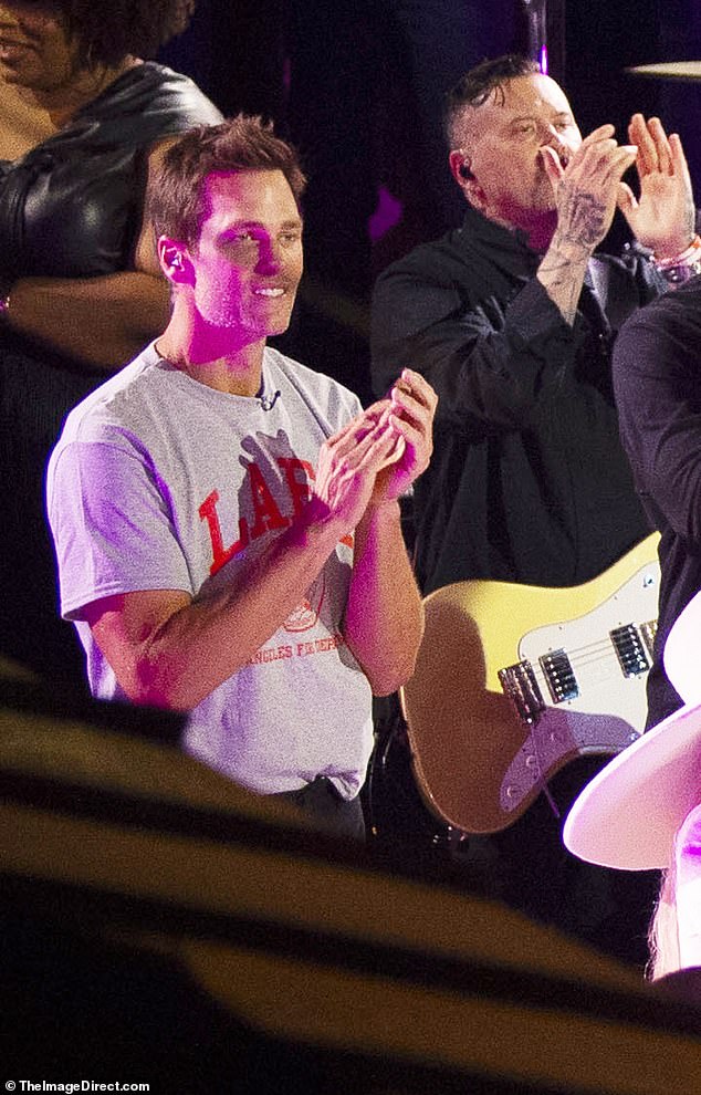 During his appearance, Brady wore a grey Los Angeles Fire Department t-shirt and cheered in the audience after Gaga was done performing