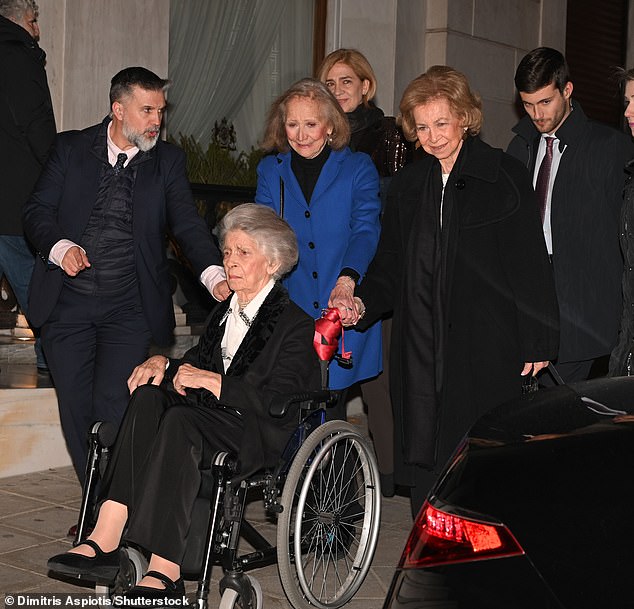 Sofia, 86 - the groom's aunt (right)- was typically sophisticated in a black coat over a white ensemble, with her brunette tresses styled in a voluminous updo