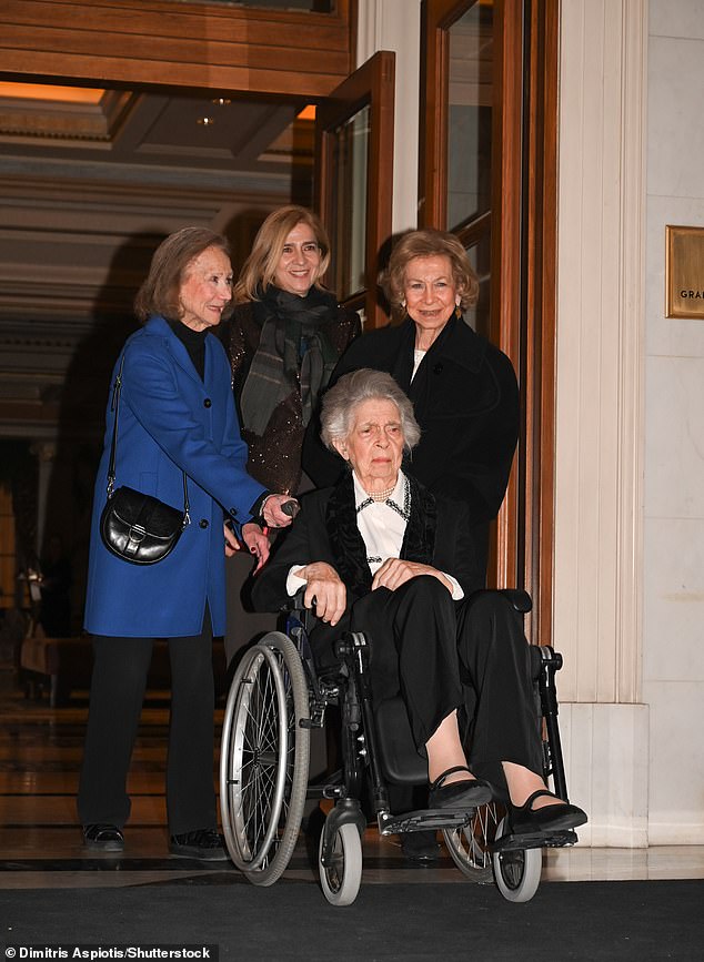 Also pictured tonight was Infanta Christina of Spain (centre), who added a touch of glitz with shimmery jacket, and wrapped up in a scarf to stay warm