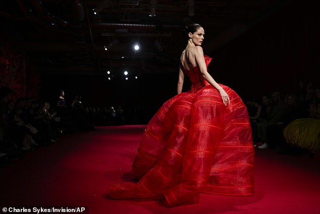 Coco Rocha was among the models walking the red carpet. She was dressed in an eye-catching scarlet off-the-shoulder dress with a bustier-like bodice and a shockingly voluminous skirt