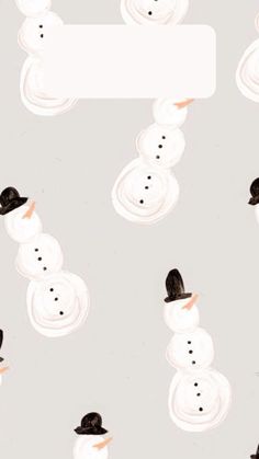 snowmen with hats and tails are standing in front of a sign