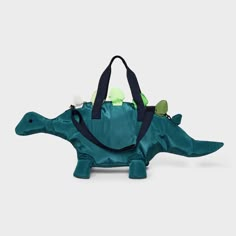 The Kids' Dinosaur Duffel Bag by Cat & Jack™ Green is perfect for young adventurers with a love for dinosaurs. With a sturdy zip closure, the main compartment ensures belongings stay secure. The adjustable strap and double handles provide versatile carrying options, making it a travel-ready companion for your little one. Ideal for young explorers, this durable dinosaur duffel bag from Cat & Jack combines style and functionality seamlessly. Cat & Jack™: Kids’ clothing with an imagination of its o Dinosaur Bag, Cat Bags, Dinosaur Stuff, Backpack Art, Jack Green, Unique Backpacks, Pocket Pet, Cat And Jack, Dinosaur Kids