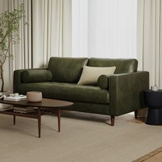 a living room scene with focus on the couch and coffee table