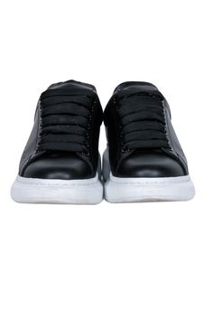 Elevate your fashion with Alexander McQueen's awesome black leather lace up sneakers. Great for a Sunday brunch with the squad, or a laid-back evening out, pair these kicks with your go-to denim and tee, or rock a playful frock. Size 6.5 (IT 36.5) Made in Italy Leather upper and lining Rubber sole Lace-up front Toe to heel 10.5" Back platform 1.75" Black Leather Low-top Lace-up Shoes, Black Low-top Lace-up Shoes With Textured Sole, Black High-top Lace-up Shoes With Rubber Sole, Black High-top Lace-up Shoes, Black Synthetic Lace-up Shoes With Textured Sole, Black Lace-up Platform Sneakers For Streetwear, Leather Low-top Lace-up Shoes With Elastic Laces, Black Lace-up Shoes For Streetwear With Round Toe, Black Lace-up Shoes With Round Toe For Streetwear