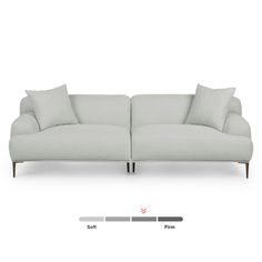 an image of a couch with pillows on the top and bottom part of it's back