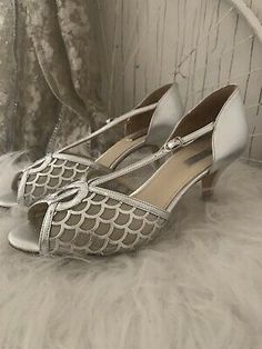 Silver Round Toe Wedding Shoes For Party, Silver Closed Toe Wedding Shoes For Gala, Silver Low Heel Wedding Shoes For Evening, Silver Low Heel Wedding Shoes For Party, Vintage Low Heel Wedding Shoes For Party, Silver Vintage Heels For Party, Silver Closed Toe Wedding Shoes For Evening, Vintage Silver Heels For Evening, Silver High Heel Wedding Shoes For Gala