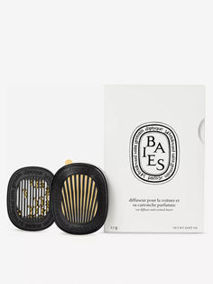 an open box with a comb in it next to a package of hair products on a white surface