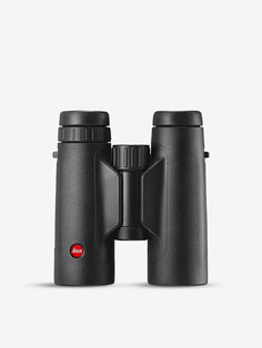 the leica 10x42 binoculars is shown with its lid open and one eye closed