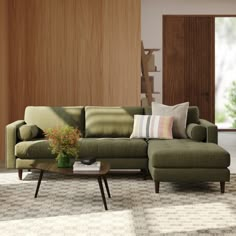 a living room with a green couch and coffee table