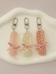 Composition : pearls, beads, ribbons, metalColor : White pearls, pink pearls, light pink crystalsCountry of Origin : Republic of Korea Beaded Umbrella, Ballet Wishlist, Bead Art Projects, Bead Figures, Beaded Shoe, Bead Dolls, Diy Keychains, Homemade Bows, Beaded Shoes