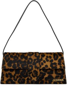 Hair-on leather and buffed leather shoulder bag in brown. · Graphic pattern printed throughout · Detachable buffed leather shoulder strap · Logo hardware at face · Card slot at back face · Magnetic flap · Card slot at interior · Cotton twill lining · Gold-tone hardware · H5 x W11 x D2.25 Supplier color: Leopard brown Leopard Print Bag, Jacquemus Bag, Leopard Bag, Fancy Bags, Pretty Bags, Cute Bags, Printed Bags, Dream Clothes, Cheetah Print