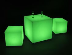 three lit up cubes sitting next to each other