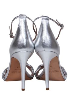 Get some sexy silver style with these strappy sandals from Rachel Zoe! Made with a shining leather with braided toe strap, these are a perfect disco-inspired party shoe to pair with all your favorite jumpsuits, flared pants or tinsel-touched cocktail dresses. Size 10 Metallic leather upper Ankle strap with buckle closure Stiletto heel Leather footbed with no signs of wear Leather sole with no signs of wear Heel 4.25” Length 10” Silver Strappy Sandals With 4-inch Heel, Silver Sandals With Ankle Strap, Silver Fitted Ankle Strap Sandals, Metallic Sandals With Padded Heel And Pointed Toe, Silver Open Toe Sandals With Wrapped Heel, Silver Open Heel Heels, Silver Fitted Heels With Open Heel, Chic Silver Sandals With Heel Strap, Fitted Silver Sandals With Heel Strap