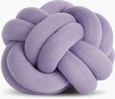 a large purple knot sitting on top of a white surface