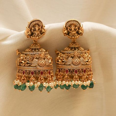 Show off India's culture and tradition by wearing perfectly handcrafted temple jewellery jhumkas! Explore our temple jewellery collection! Latest Design Earrings Gold, Gold Wedding Earrings Indian, Lakshmi Jhumkas Gold, Gold Antique Jhumkas, Cz Earrings Indian Gold, Temple Jewellery Earrings Antique, Antique Gold Jhumka, Jumka Earrings Gold Indian Jewelry, Temple Earrings Gold Jewelry