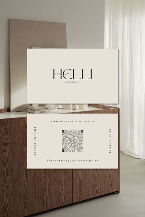 Elegant business card design for Helli Patrimoine, a real estate company. The card features a clean and modern design with a blue and white color.#BusinessCards #NetworkingEssentials #ProfessionalBranding #CardDesign #EntrepreneurTips Graphic Designer Card Business, Logo For A Graphic Designer, We Code Business Card, Business Card Ideas With Qr Code, Visiting Card With Qr Code, Qr Card Design, Business Card Elegant, Qr Code Business Card Design, Visiting Cards Design Unique