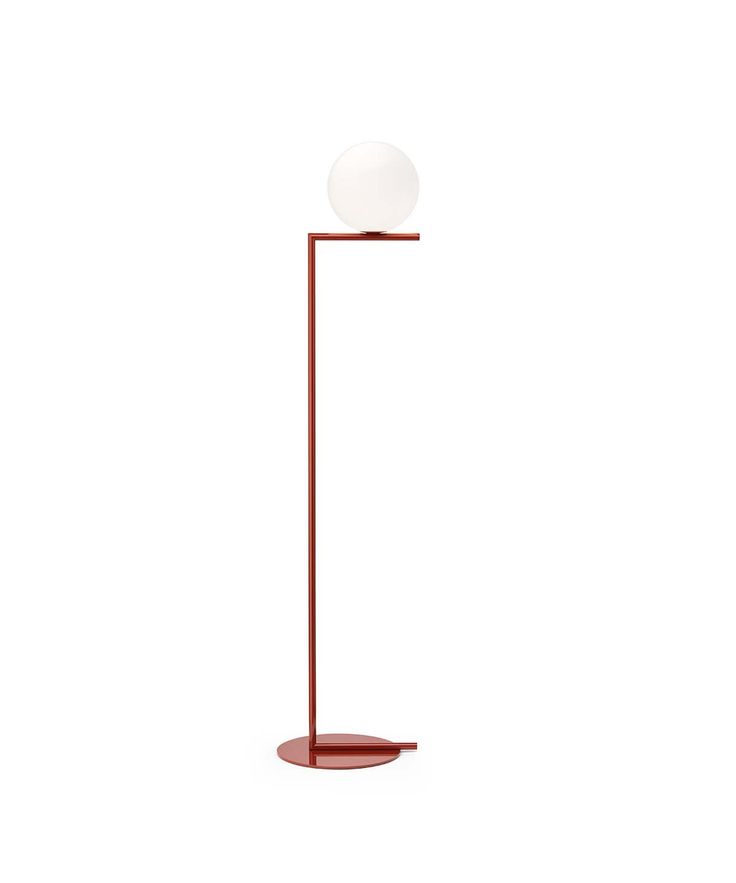 a red floor lamp with a white ball on it's top and a metal base