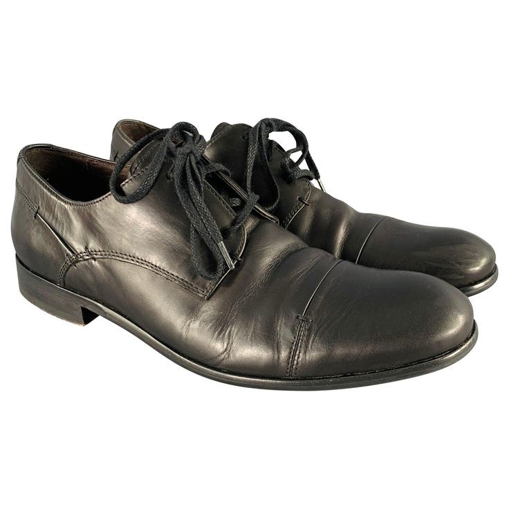 JOHN VARVATOS shoes in a black leather fabric featuring a derby style, wooden sole, and lace-up closure. Excellent Pre-Owned Condition. Marked: F2093N3BA4B 001 9.5MOutsole: 11.75 inches x 3.75 inches Sui Generis Reference: 131785 Category: Lace Up Shoes More Details Brand: JOHN VARVATOS Gender: Male Size: 9.5 Color: Black Fabric: Leather Age Group: Adult Black Leather Fabric, Manolo Blahnik Red, Manolo Blahnik Black, Leather Strap Sandals, Suede Block Heels, Loafers Style, Block Heel Boots, John Varvatos, Perforated Leather