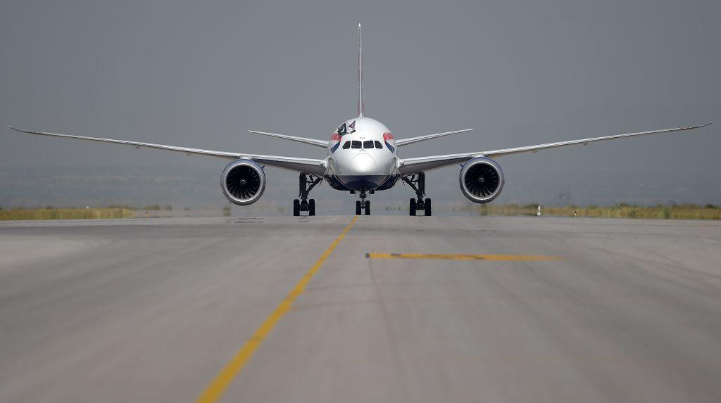 Plane seen from head-on, on a runway at Heathrow 