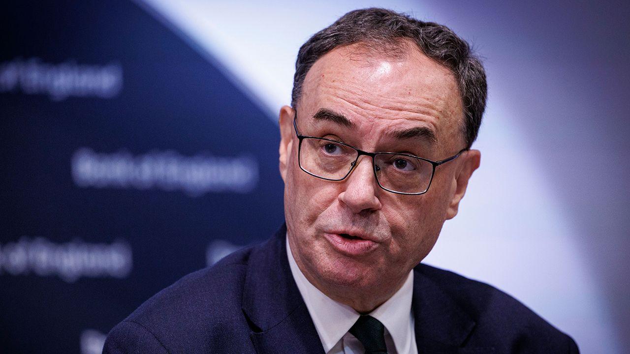 A head and shoulders shot of Bank of England governer Andrew Bailey looking away from camera as he speaks at a press conference in London on 7 November